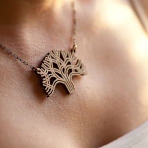 Lasercut Bamboo Oakland Pendant on Neck Lasercut Bamboo Oakland Pendant on Neck